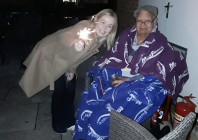 Sparklers in the garden on bonfire night at Abbotsleigh Care Home