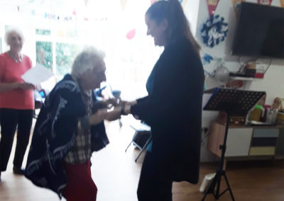Abbotsleigh staff member and resident dancing together