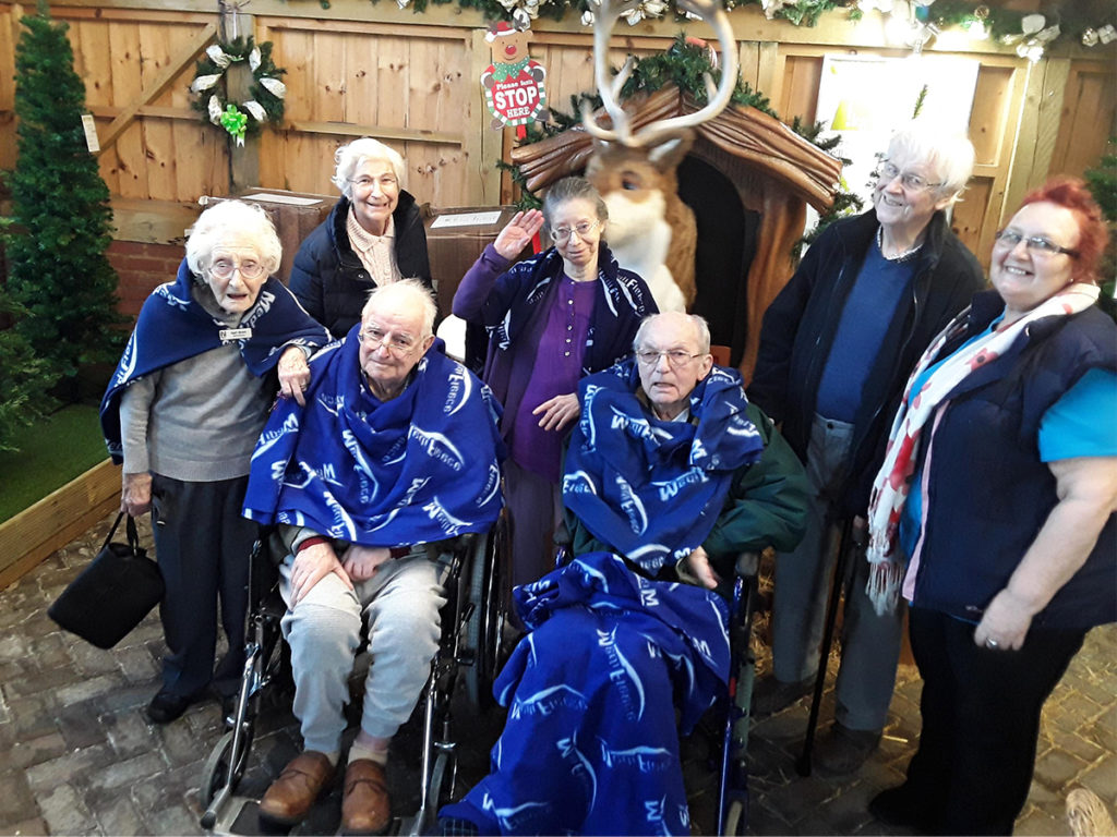 Abbotsleigh Care Home residents at a garden centre enjoying the festive displays