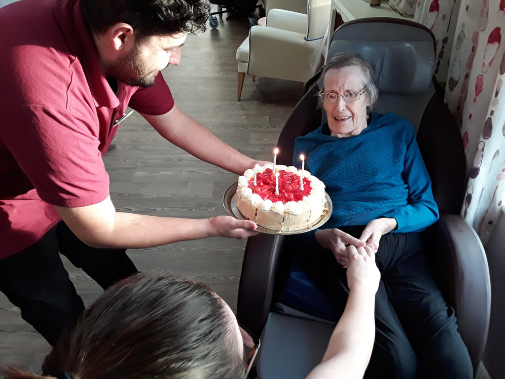 Abbotsleigh Care Home lady resident receiving a birthday cake