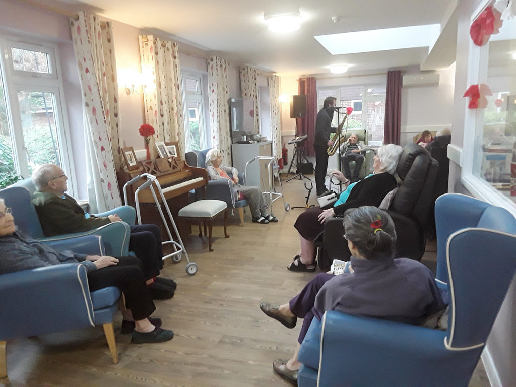 Saxophonist performing for the residents of Abbotsleigh Care Home