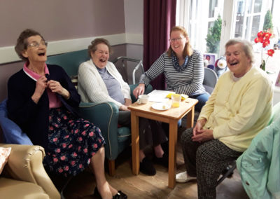 Abbotsleigh lady residents and family having a laugh together