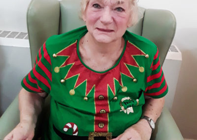 Lady dressed as an elf at Abbotsleigh Care Home