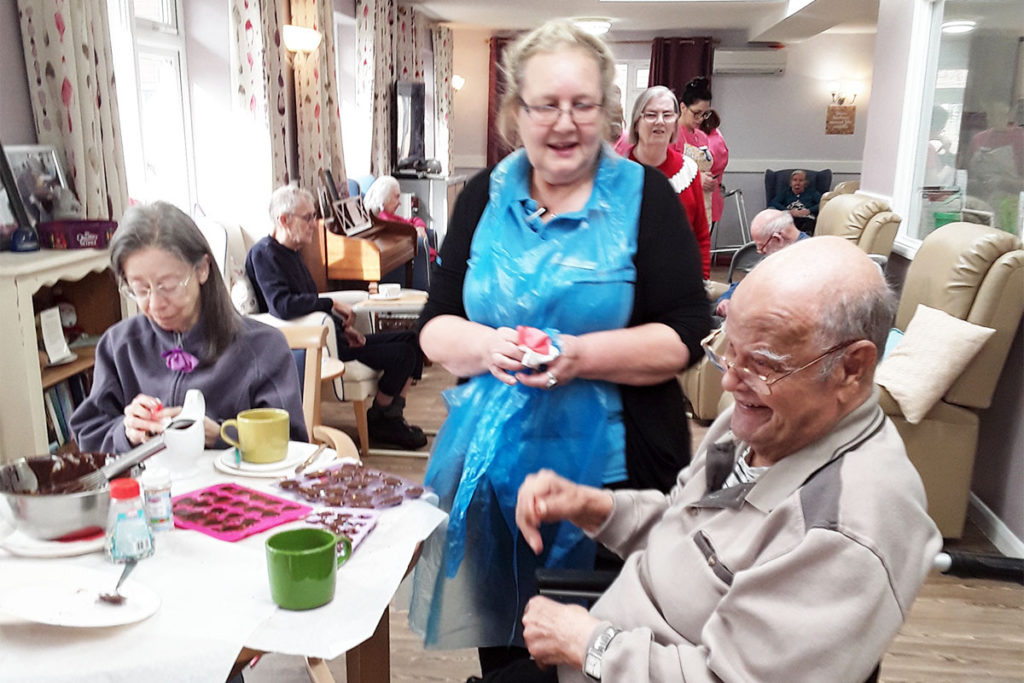 Staff and residents at Abbotsleigh making chocolate hearts for Valentine's Day