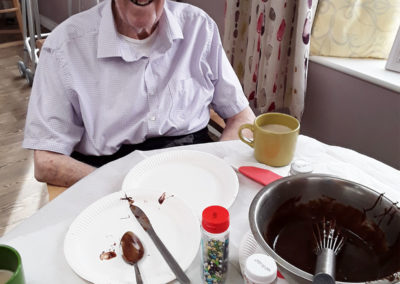 Resident at Abbotsleigh with a bowl of chocolate