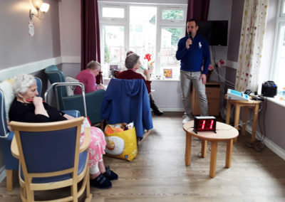Residents enjoying bingo in the lounge at Abbotsleigh