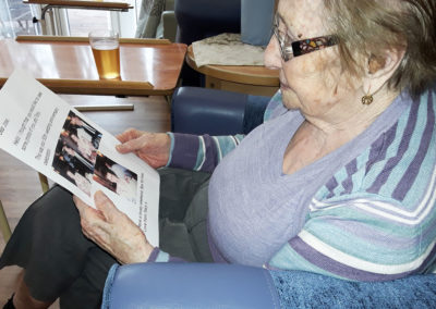 Resident reading a letter from family at Abbotsleigh Care Home