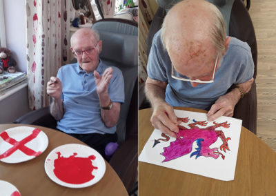 Gentleman residents painting St George's Day pictures at Abbotsleigh Care Home