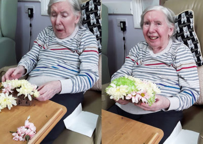 Lady resident flower arranging at Abbotsleigh Care Home