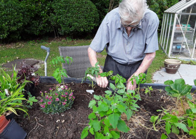 Male resident gardening at Abbotsleigh