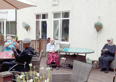 Residents enjoying Rob T performing outside Abbotsleigh Care Home 3