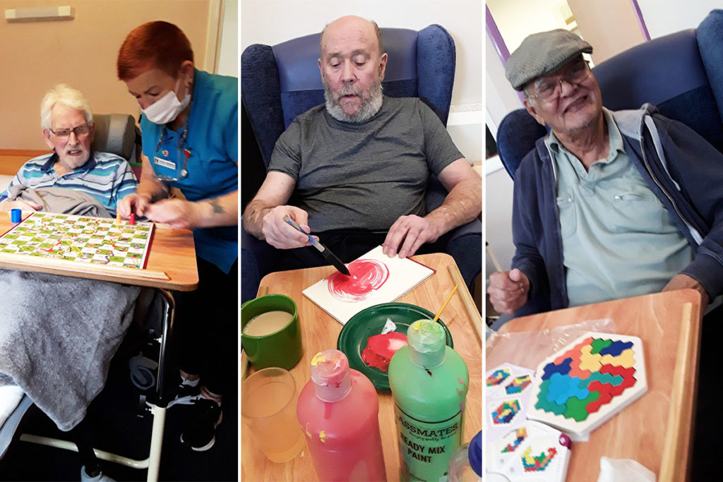 Residents enjoying puzzles and painting at Abbotsleigh Care Home