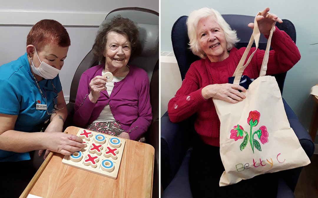 Enjoying crafts and board games at Abbotsleigh Care Home