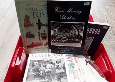 Library box full of reminiscence books and newspapers
