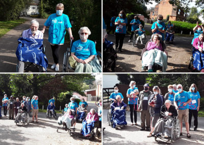 Staff, residents and families at Abbotsleigh Care Home doing a sponsored charity walk together