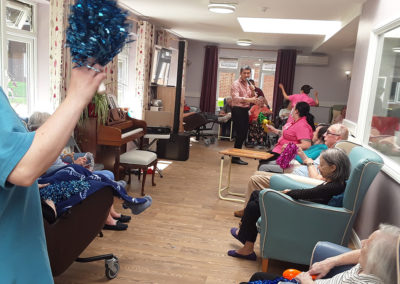 Abbotsleigh Care Home residents and staff enjoying Kevin Walsh's musical performance
