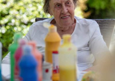 Our ladies at Abbotsleigh Care Home enjoying some creative painting and fresh air in the garden